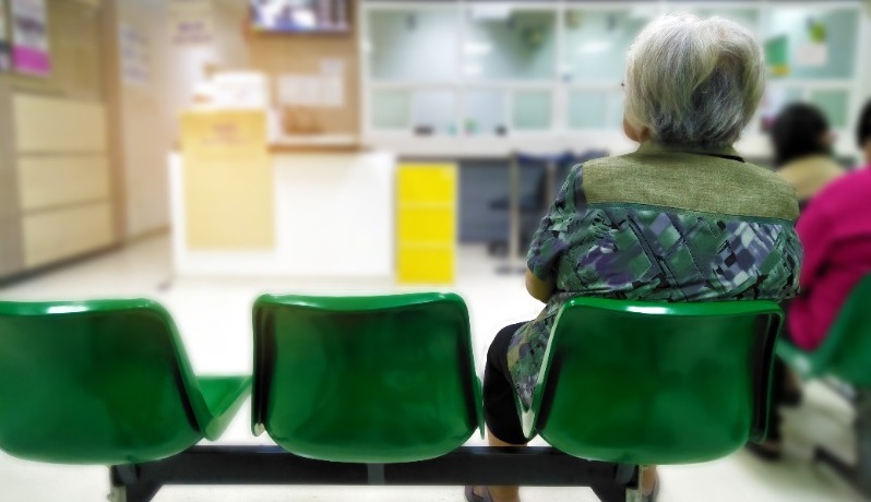 Woman Seated in Hospital Waiting Room